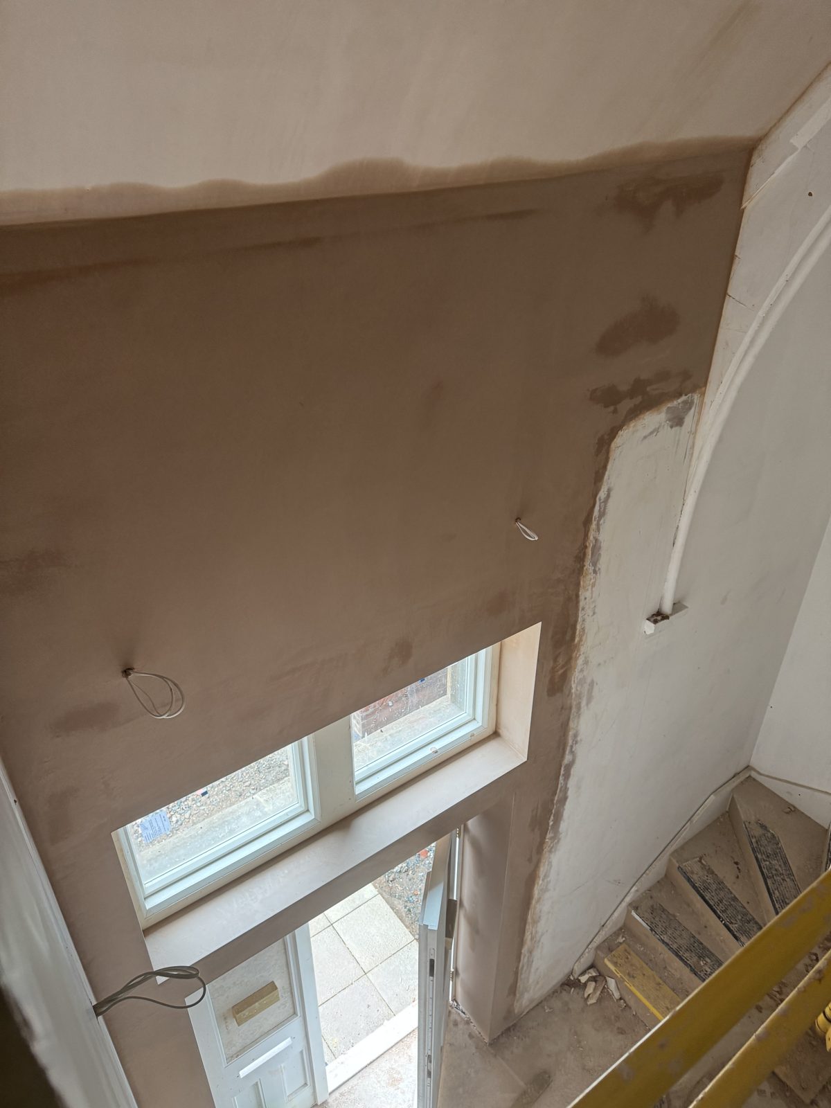 Freshly skimmed walls around a window